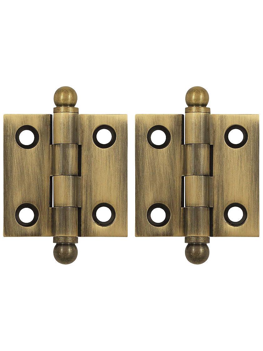 Pair of Solid Brass Cabinet Hinges - 1 1/2 inch x 1 1/2 inch in Antique Brass.